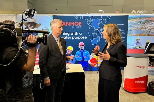 Interview in front of the Ivanhoe Mines trade show display